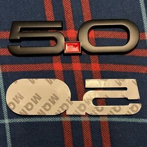 🔥5.0 Black emblem With Red Dot For Mustang NIP (1 Piece) and the adhesive.